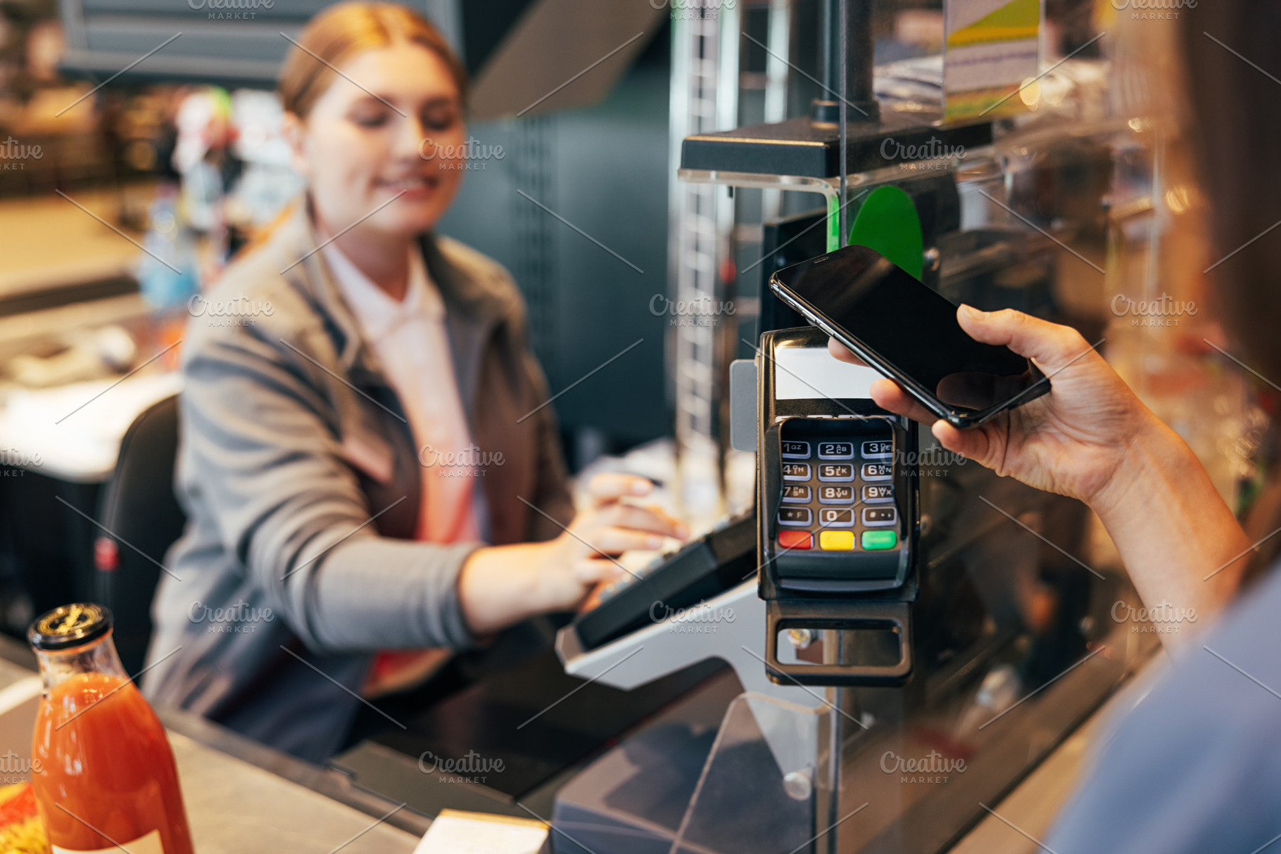 Unrecognizable woman paying by phone, a Person Photo by Artem Varnitsin