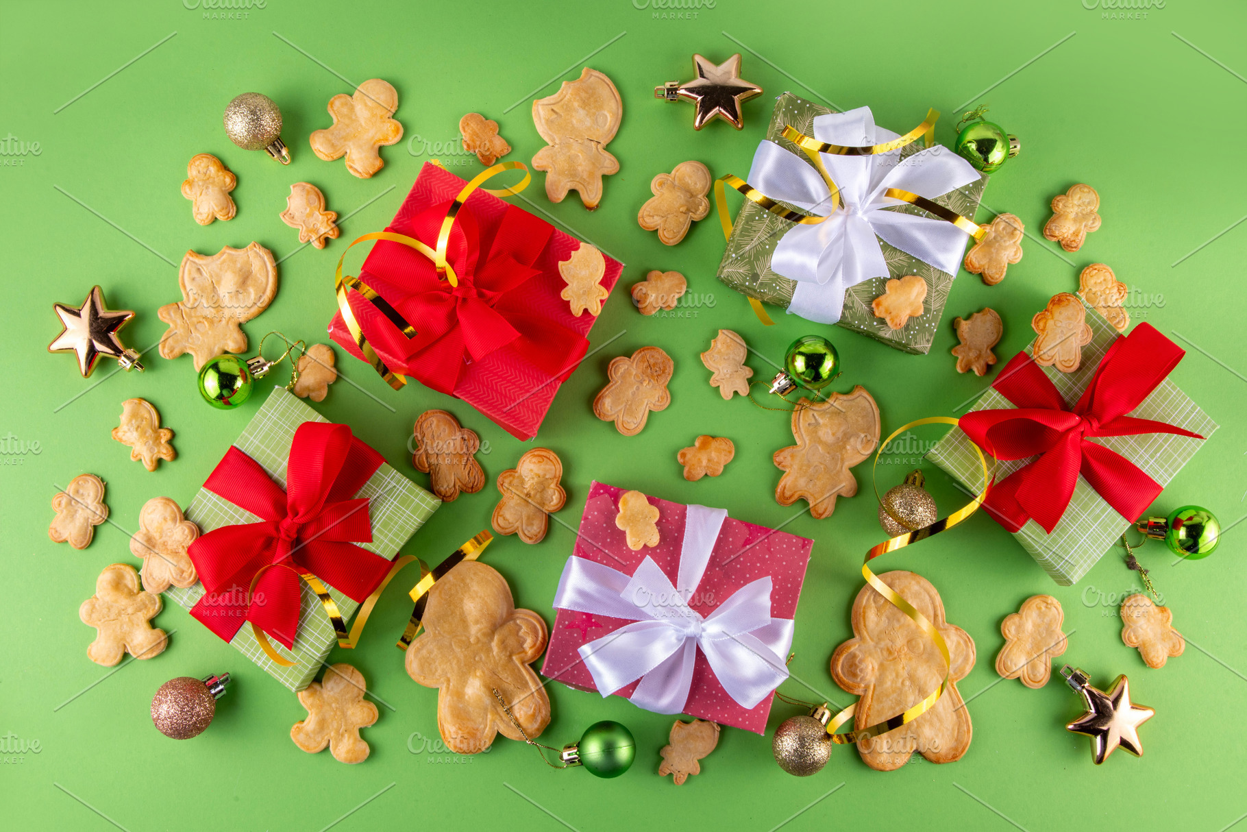 Christmas background with gingerbread man cookies, gifts and bau, a Photo by Rimma