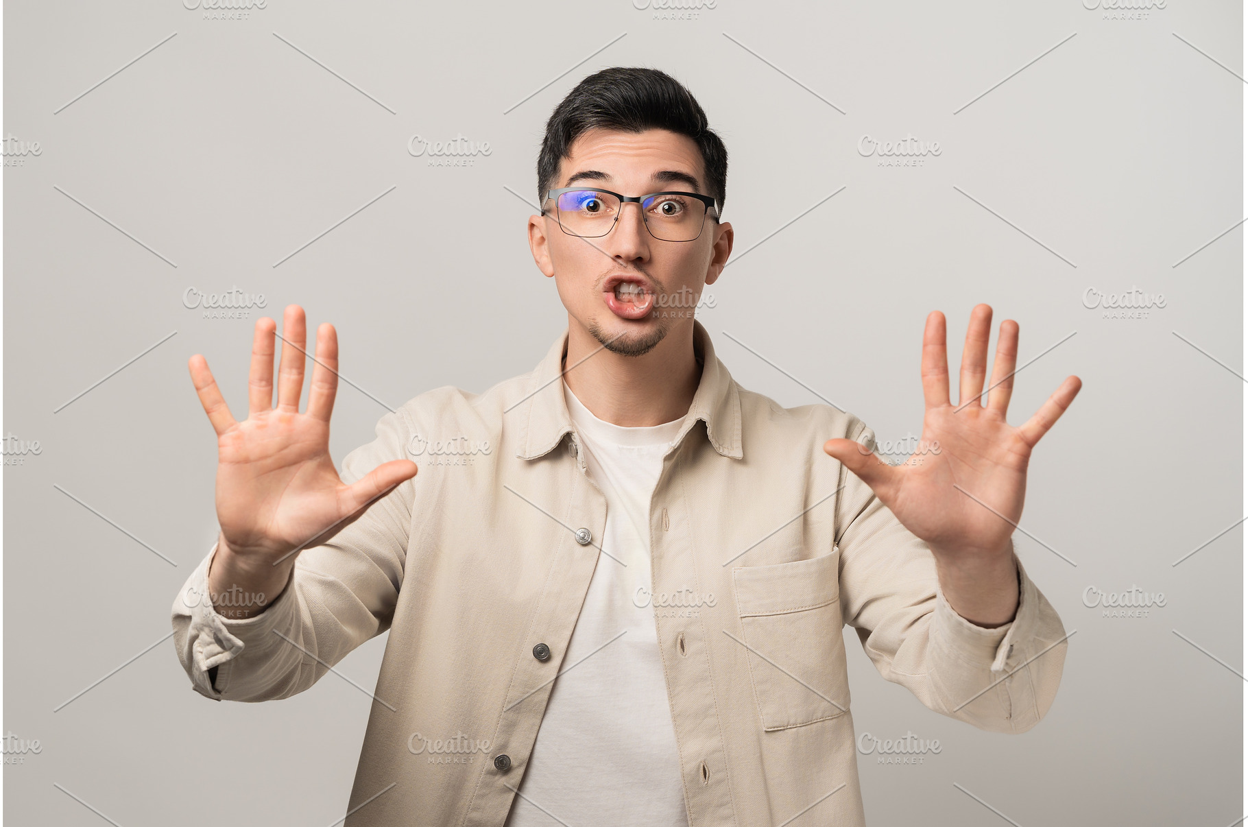 Stop. Calm down. A reassuring man in, a Person Photo by AD Stock Images