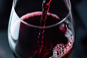 Elegant Pouring of Wine into a Glass, a Food & Drink Photo by Virgo Studio