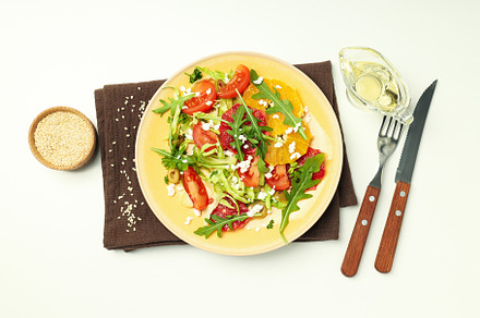 Concept of tasty food with salad with red orange, a Food & Drink Photo by AtlasStudio