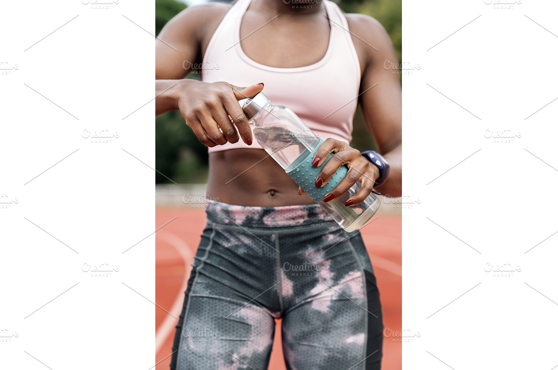 Athlete sprinter opening a bottle of, a Sports & Recreation Photo by nunezimage