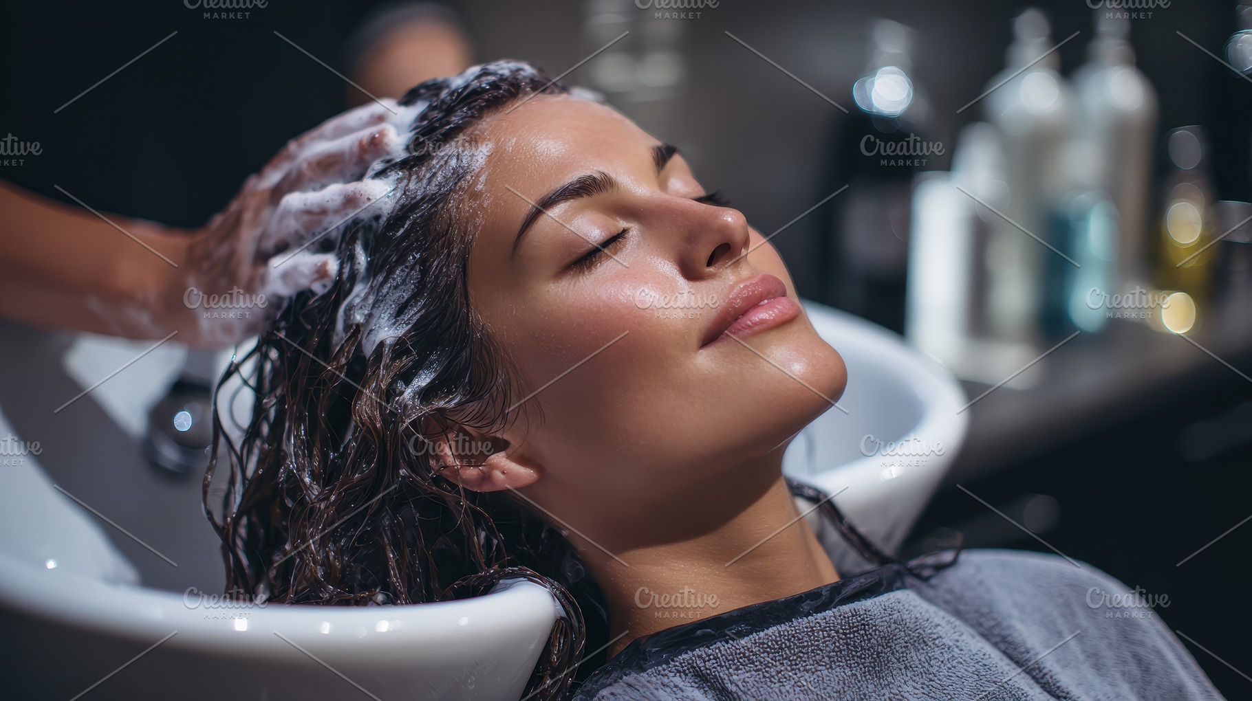 Woman getting hair washed at salon r, a Photo by Pixeness Studio