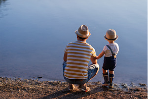 Father and little son looking at, a Person Photo by HalfPoint