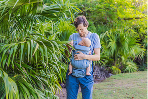 Young father walks in nature with, a Person Photo by Elizaveta Galitskaya