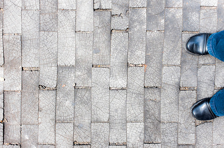 Two Feet on Brick Floor Backdrop