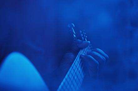 Acoustic concert guitar player man hands smoke, a Person Photo by Photo Drive Studio