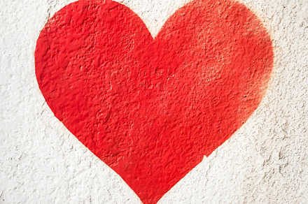 Red heart on wall, a Wallpaper Photo by KYNA STUDIO