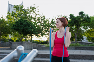 Young woman exercising with, a Graphic by HalfPoint