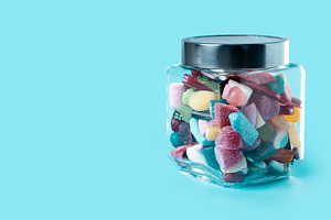 Colorful assorted gummy candies in glass jar, a Food & Drink Photo by etorres69