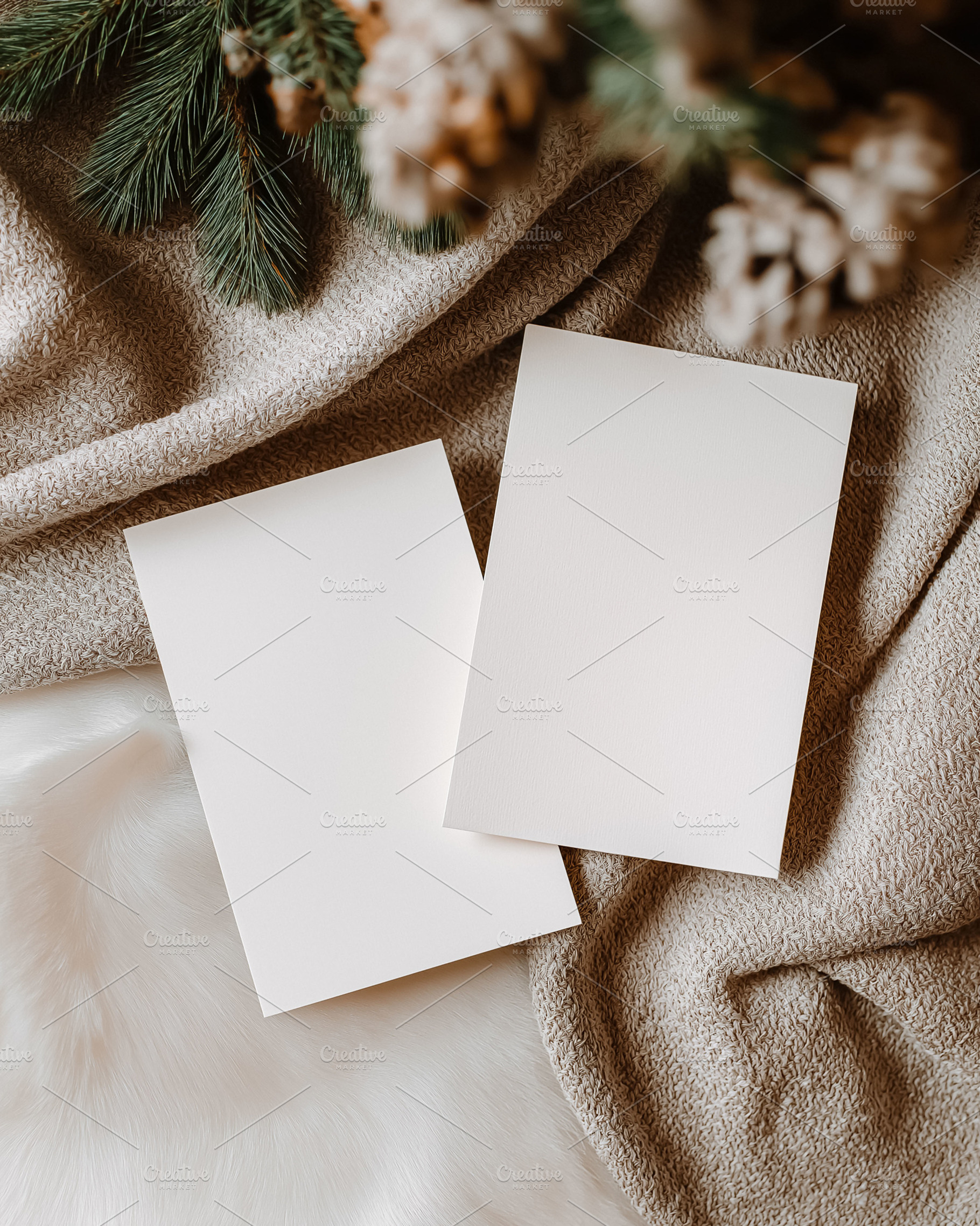 Blank Christmas cards mockup on cozy winter fabrics, creating a festive holiday, a Holiday Photo by Studio ANNA