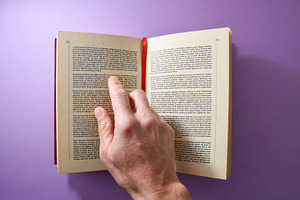 Person reading a book pointing at text with your finger, a School & Education Photo by Davizro's Market