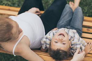 Happy little boy hugging mother featuring outdoor, travel, and child