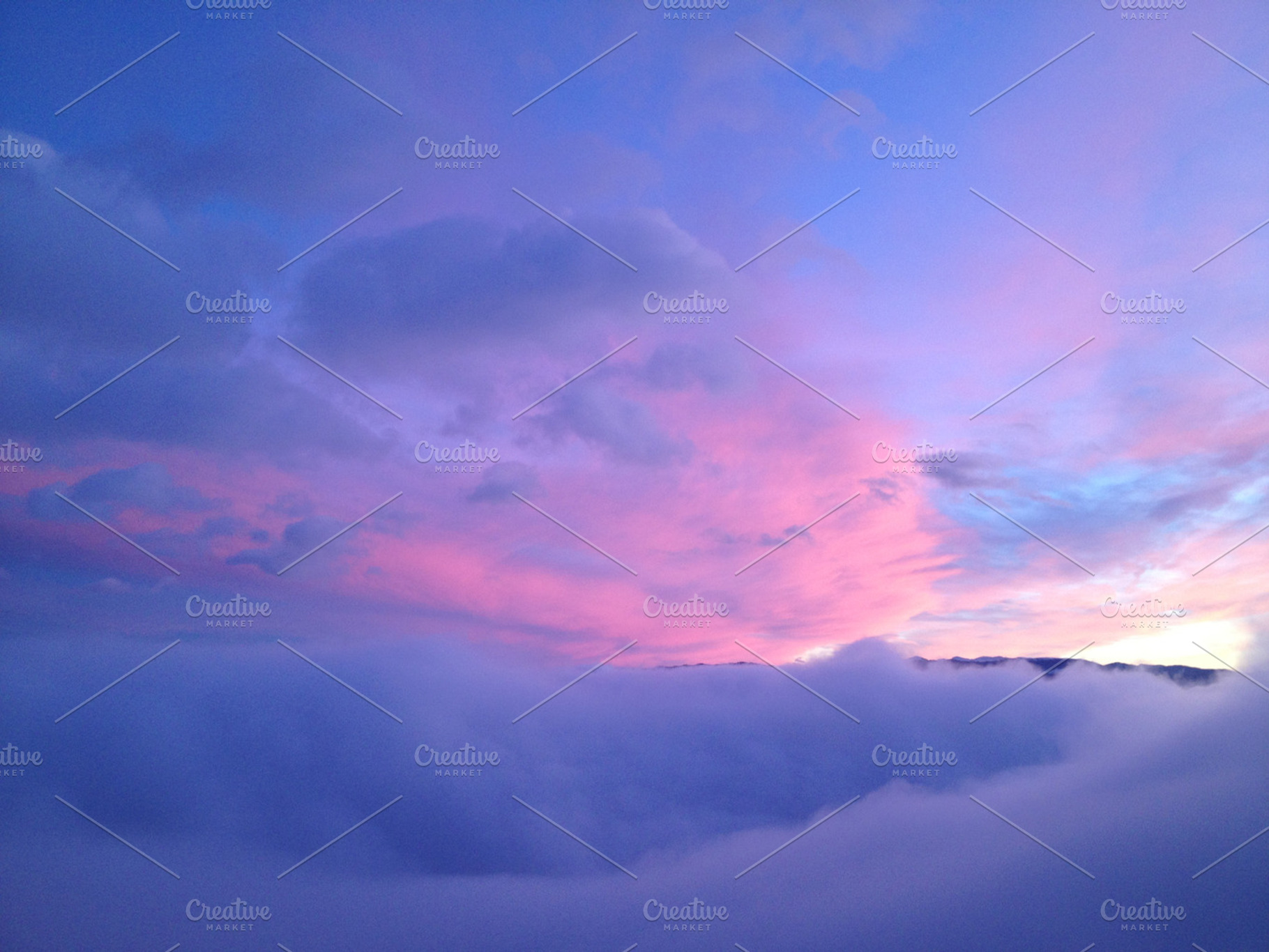 Purple blue sunset featuring sunset, hills, and purple