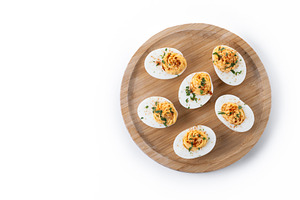 Homemade hard Boiled Deviled Eggs garnished with herbs, a Food & Drink Photo by etorres69