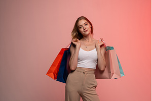 Smiling woman holding shopping bags, a Person Photo by volodymyrshtun13795