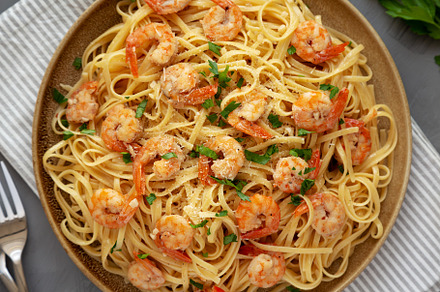 Baked Shrimp Scampi Linguine Pasta with Parsley on a Plate, top, a Food & Drink Photo by LiudmylaChuhunova