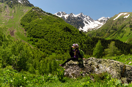 Girl enjoying view from large rock, a Wallpaper Photo by Elena Vagengeim