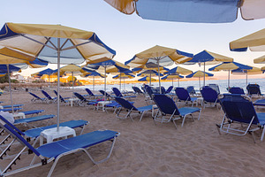 Empty Sun Loungers and Thatched