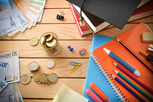 Concept cost of school supplies with material and money, a School & Education Photo by Davizro's Market