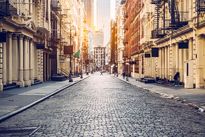 Empty street at sunset time in soho containing american, famous, and historic