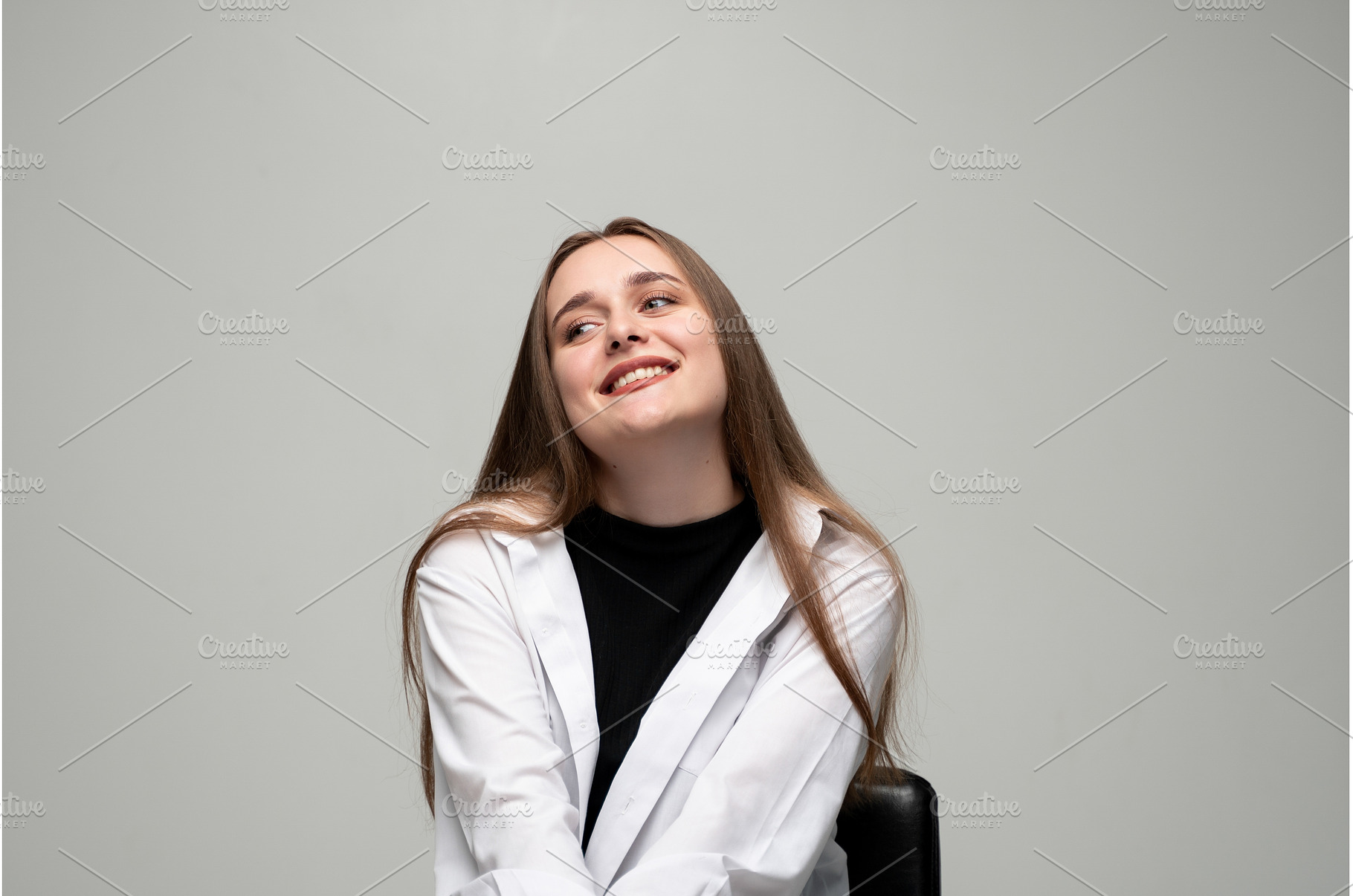 Young woman smiling while looking, a Person Photo by volodymyrshtun13795