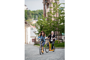 Travellers couple on electric, a Person Photo by HalfPoint