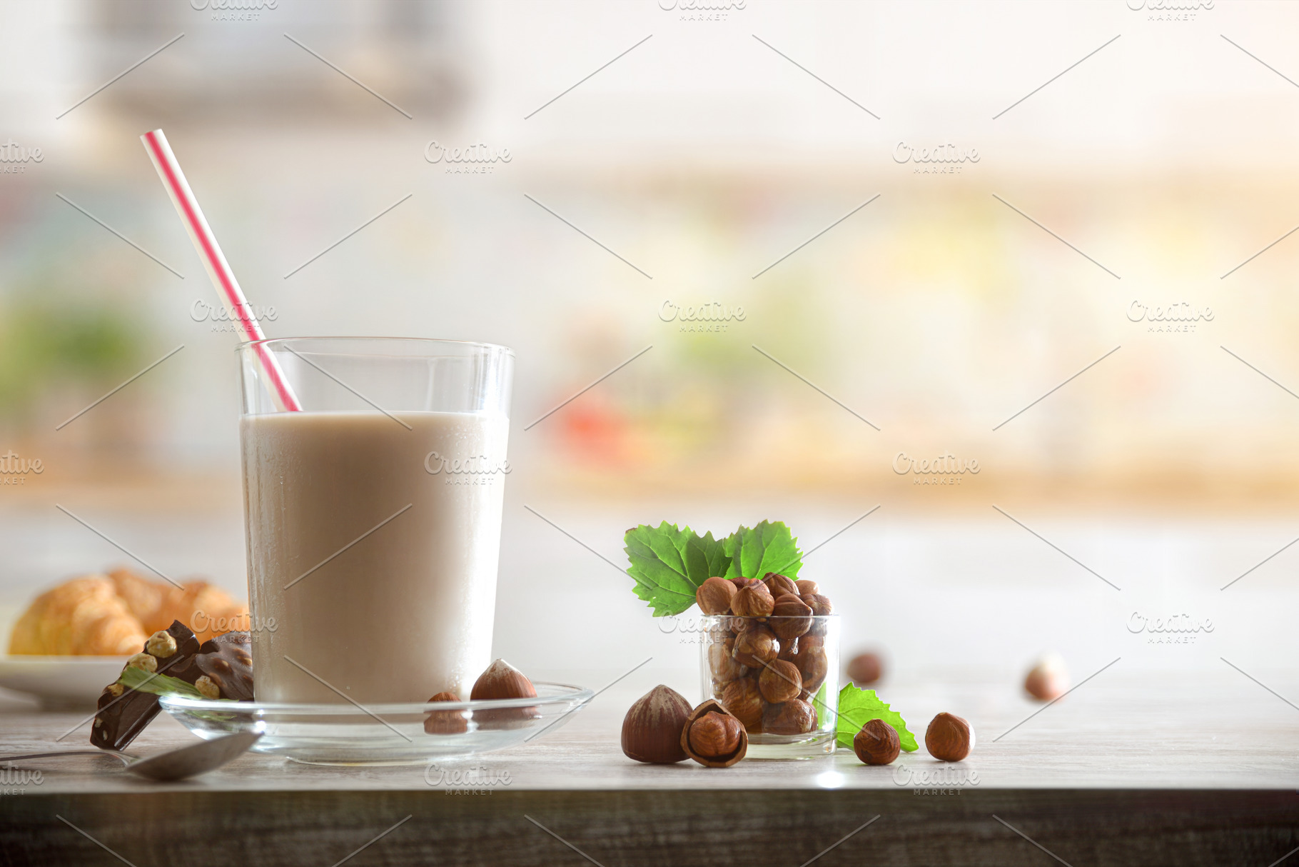 Background with glass with hazelnut drink and nuts in kitchen, a Food & Drink Photo by Davizro's Market