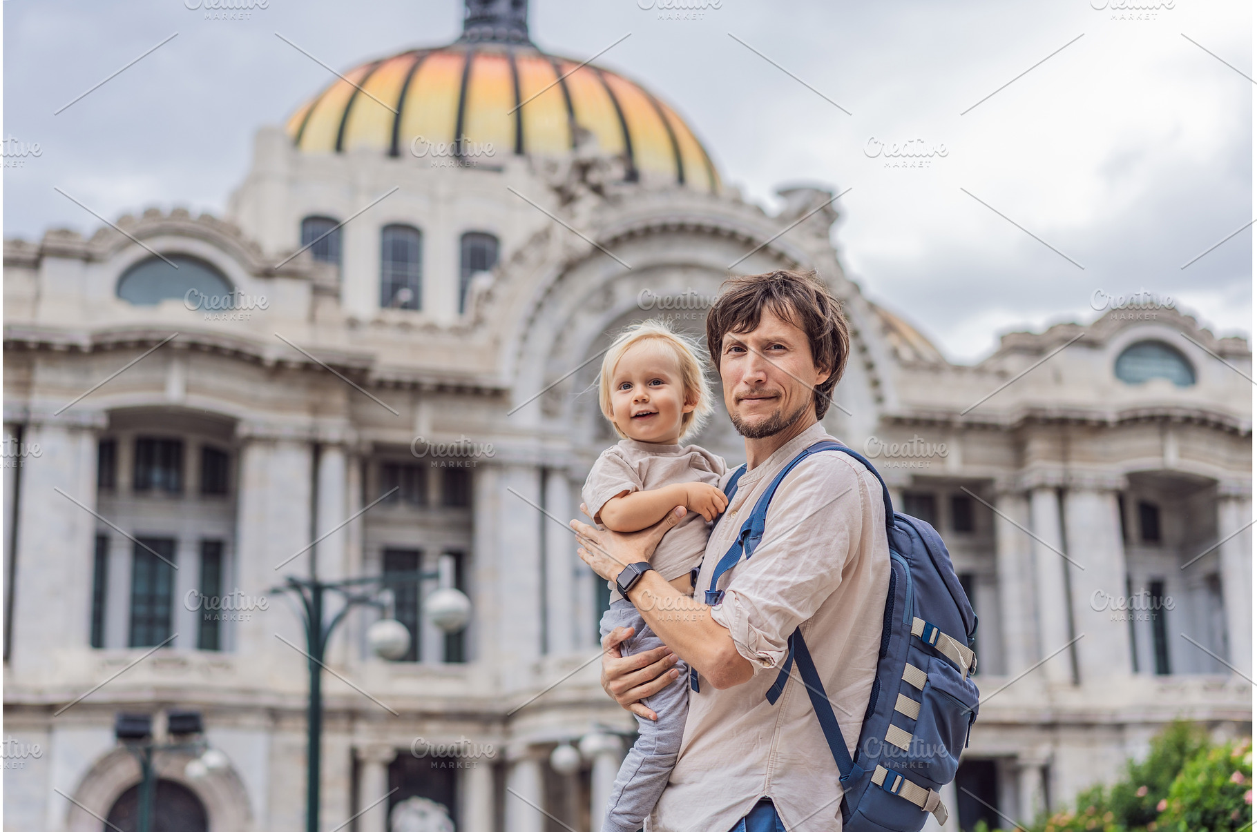 Father tourist lifting his little, an Architecture Photo by Elizaveta Galitskaya