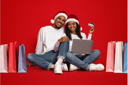 Happy black couple with shopping, a Person Photo by Prostock-Studio