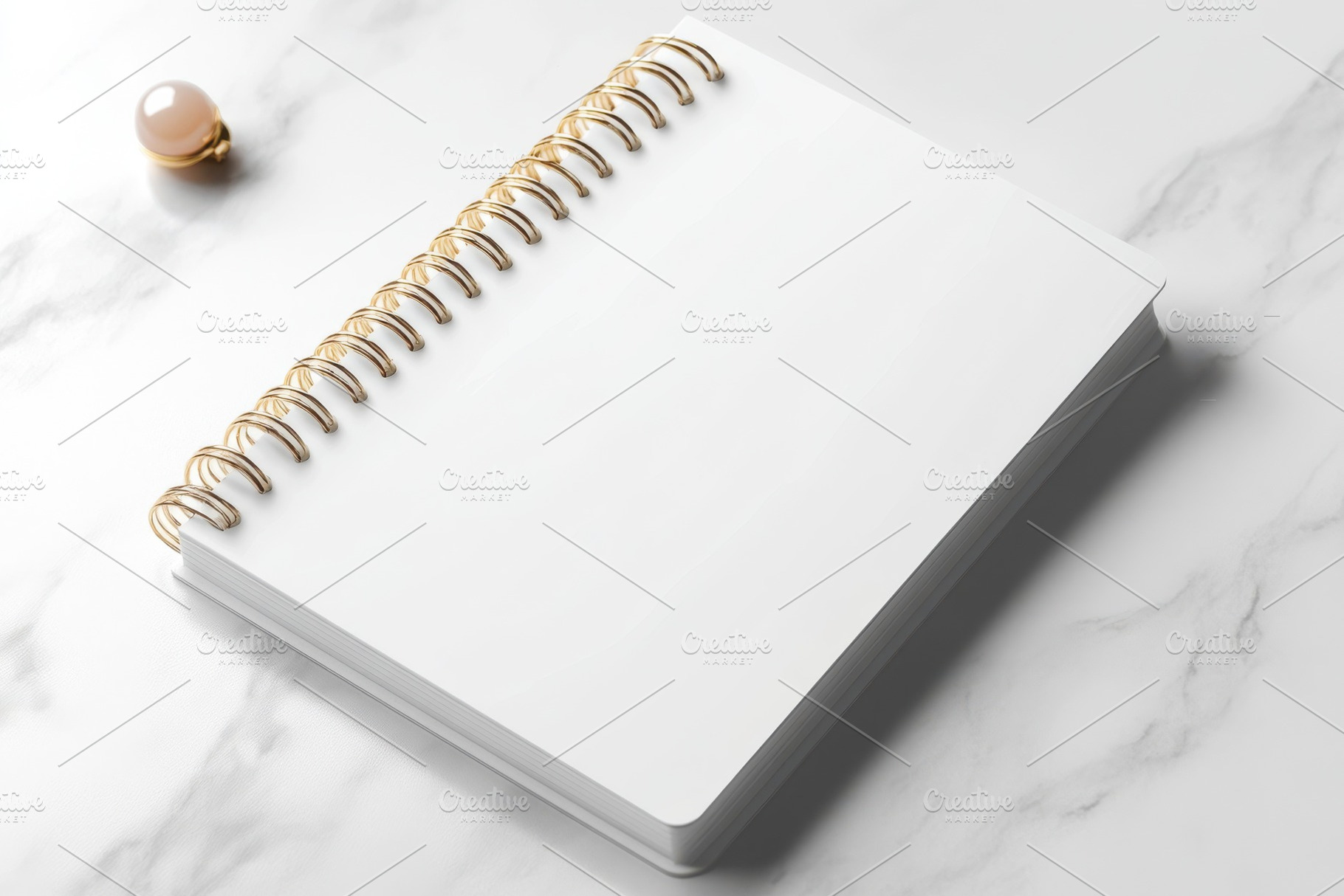 Blank spiral notebook on marble back, a Background Photo by Pixeness Studio