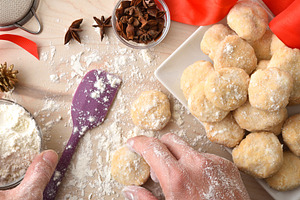 Person making anise cookies with ingredients around top view, a Food & Drink Photo by Davizro's Market