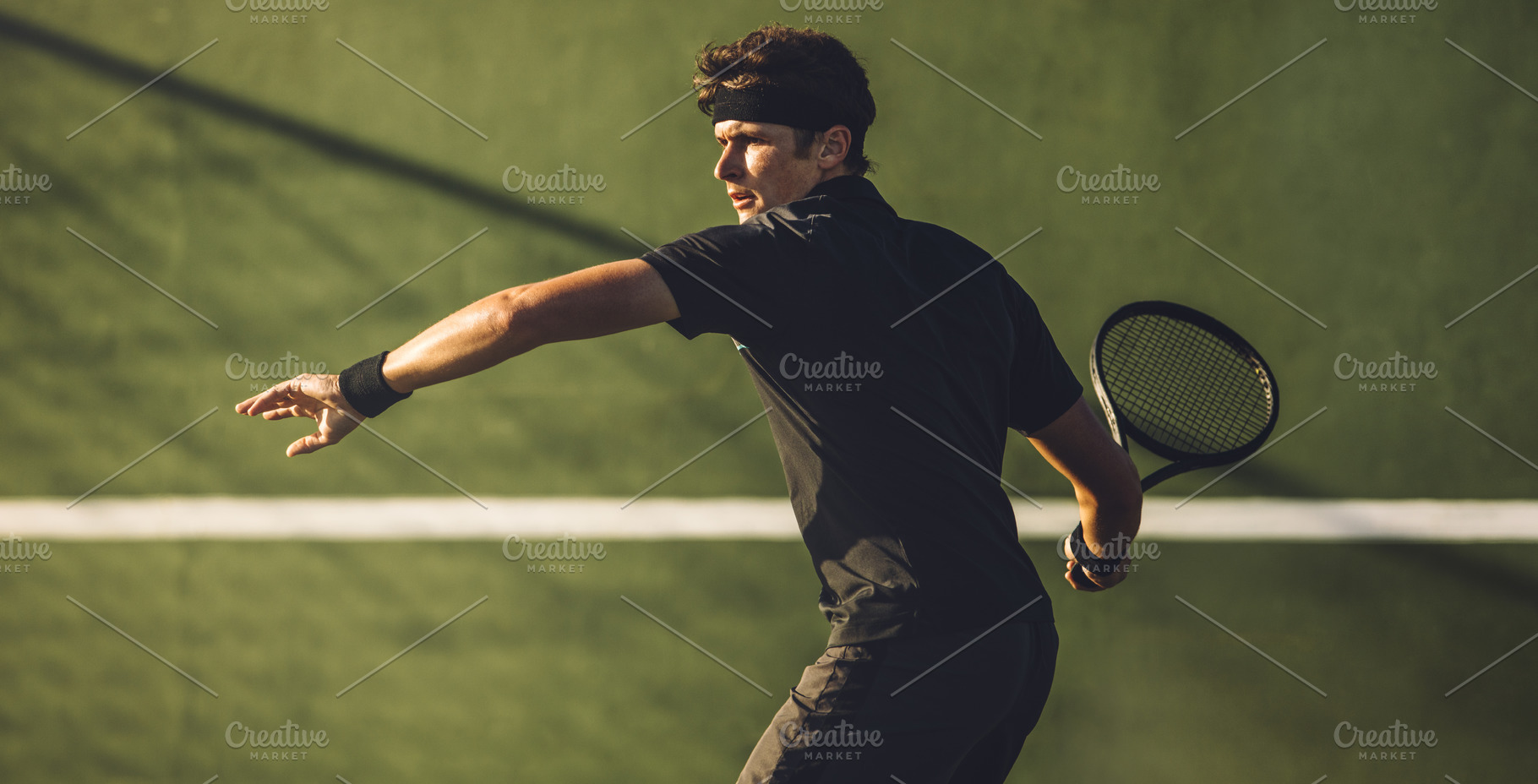 Tennis player playing on hard court stock photo containing athlete and ball, a Sports & Recreation Photo by Jacob Lund