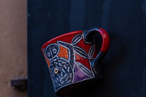 Ceramic cups as a handle on old door, an Architecture Photo by Anna Bogush