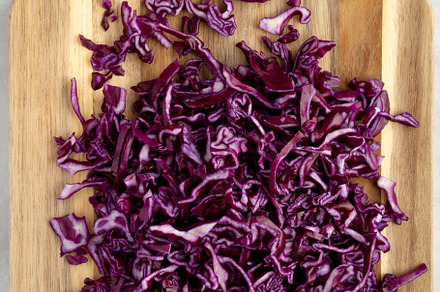 Shredded Purple Cabbage on a Board, top view. Flat lay, overhead, a Food & Drink Photo by LiudmylaChuhunova