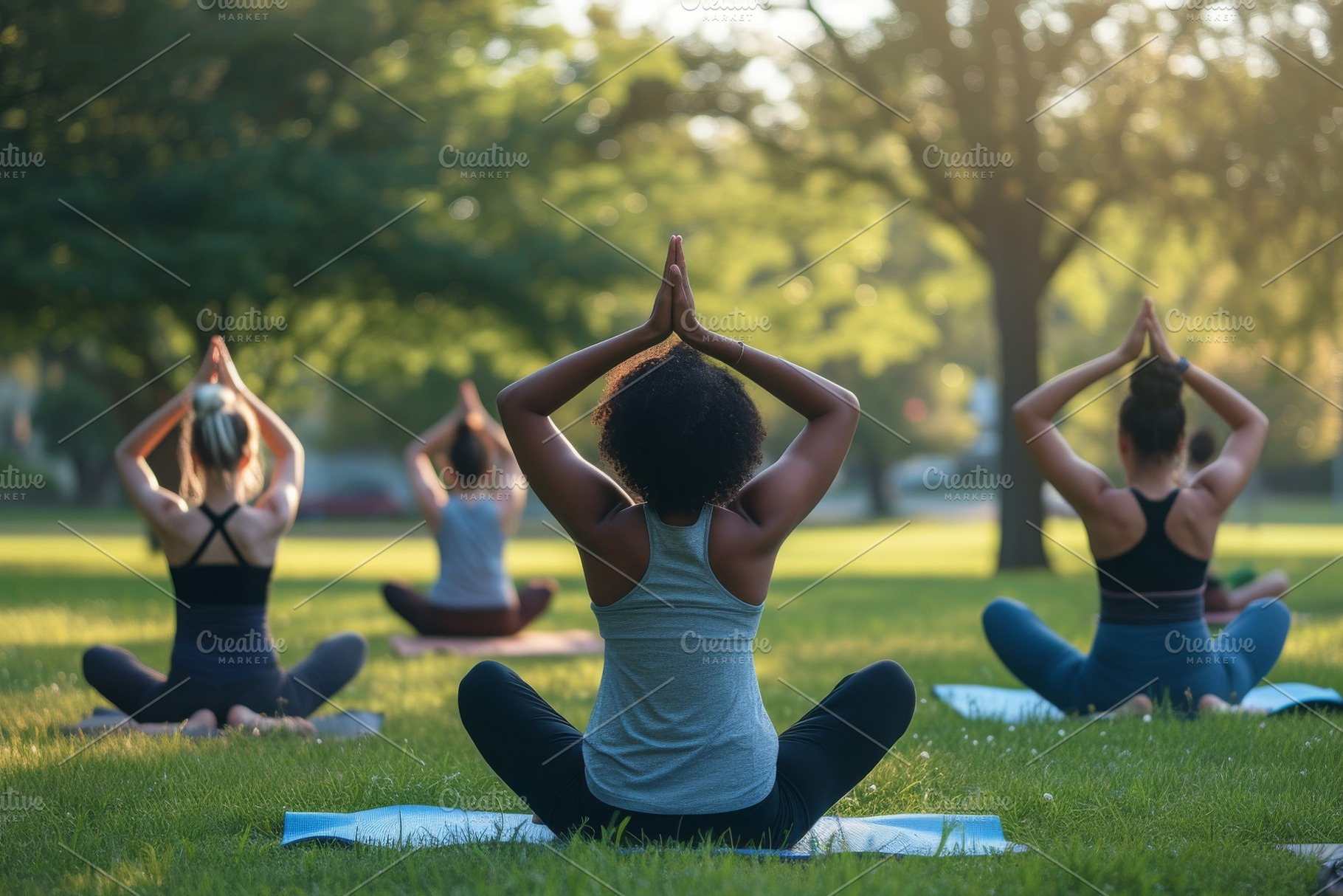 Several women engage in yoga poses i, a Photo by Iftikhar Alam