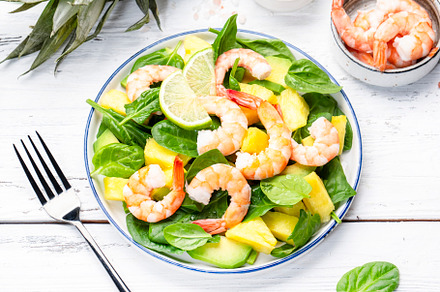 Shrimp pineapple salad with spinach, avocado and lime on white w, a Food & Drink Photo by 5PH