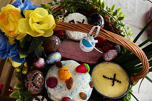 Easter basket arrangement with traditional treats and festive decor in light se, a Photo by AS photostudio