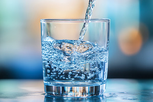 Fresh water being poured into clear, a Photo by MistyDay