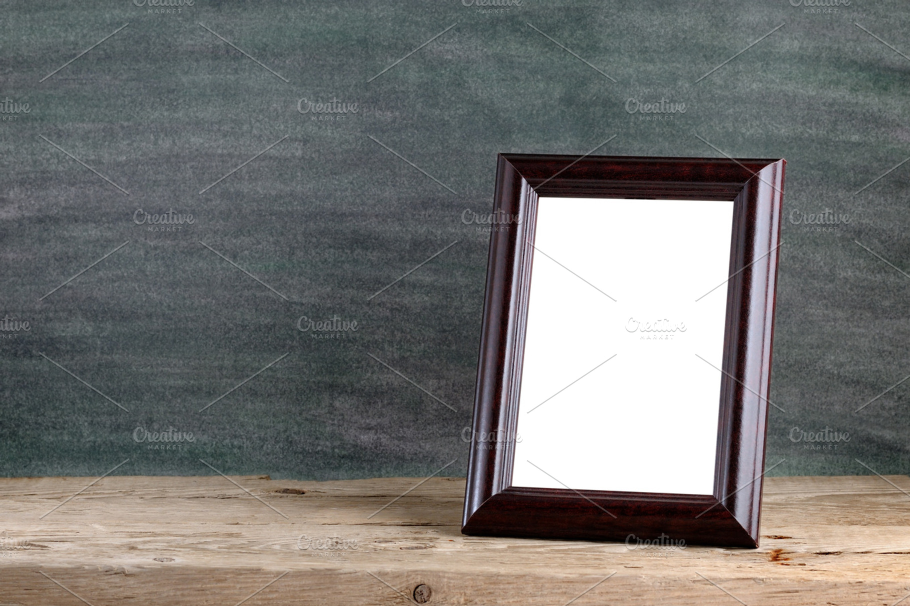 Old photo frame featuring photo, frame, and wood