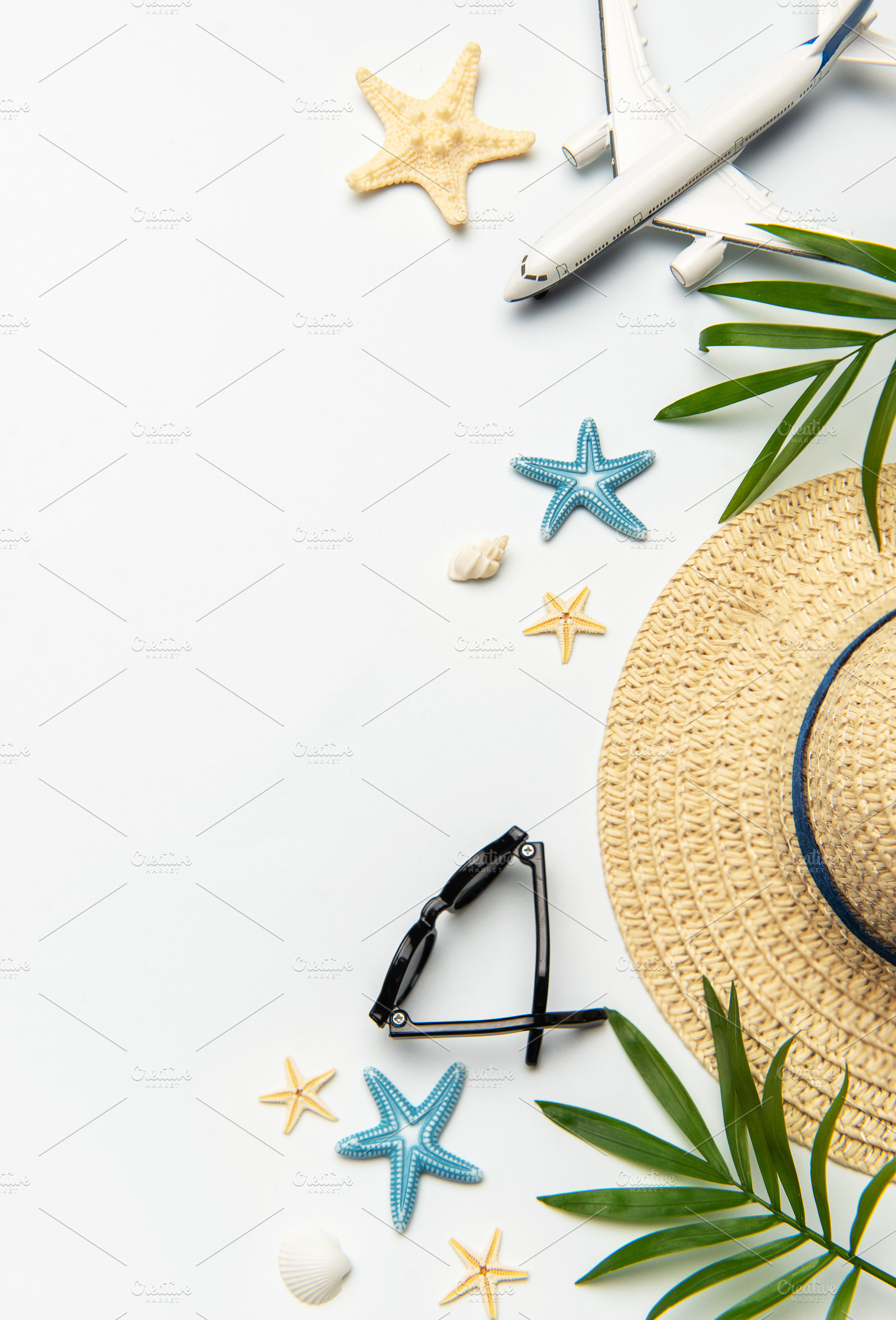 Summer vacation concept featuring airplane, sunglasses, straw ha, a Holiday Photo by Olena Rudo