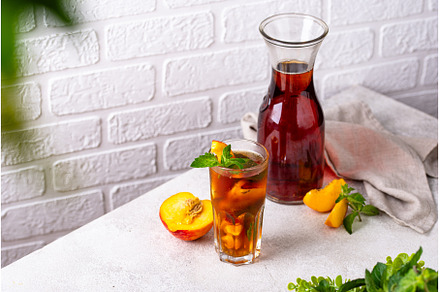 Cold ice tea with peach and mint, a Food & Drink Photo by Yulia Furman