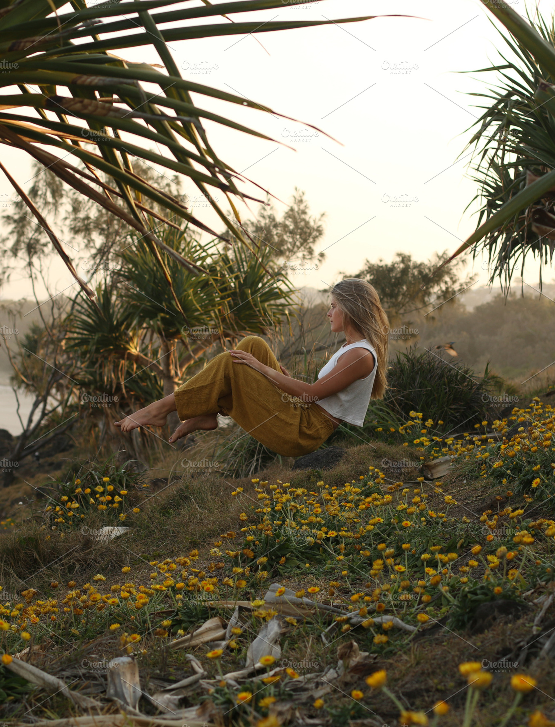 Levitation above flowers, a Person Photo by Chris Joel Campbell