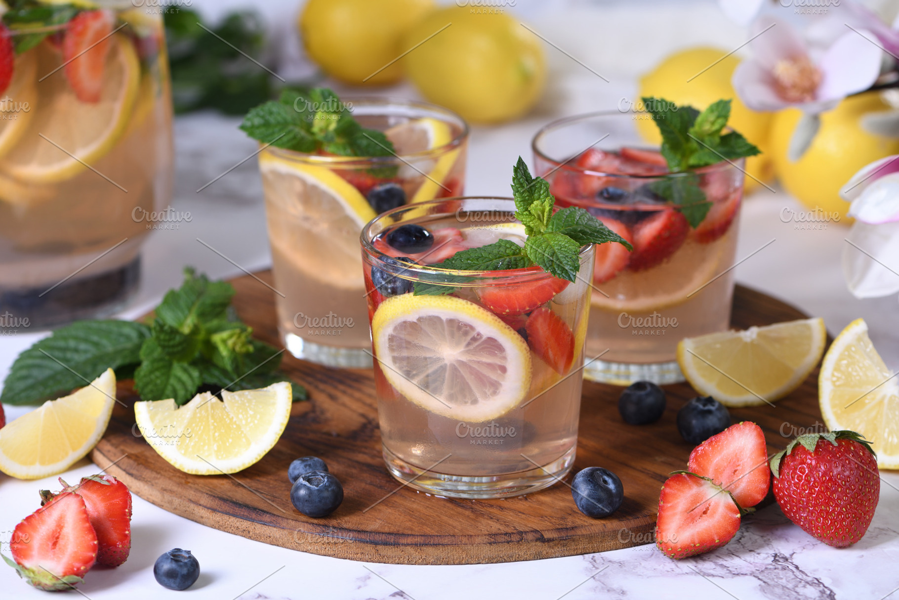 Lemonade with strawberries, blueberr, a Food & Drink Photo by Apolonia