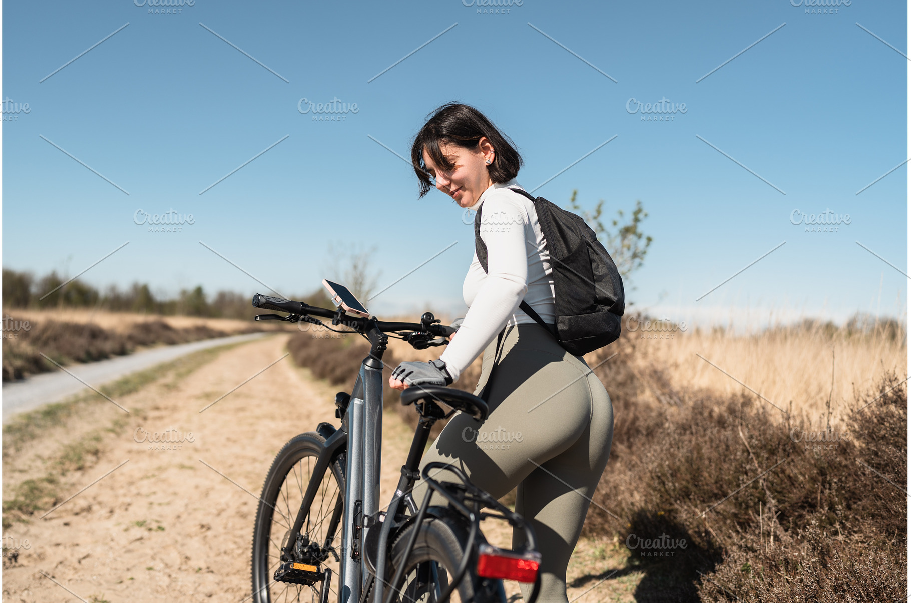Free-spirited woman with backpack, a Sports & Recreation Photo by AD Stock Images