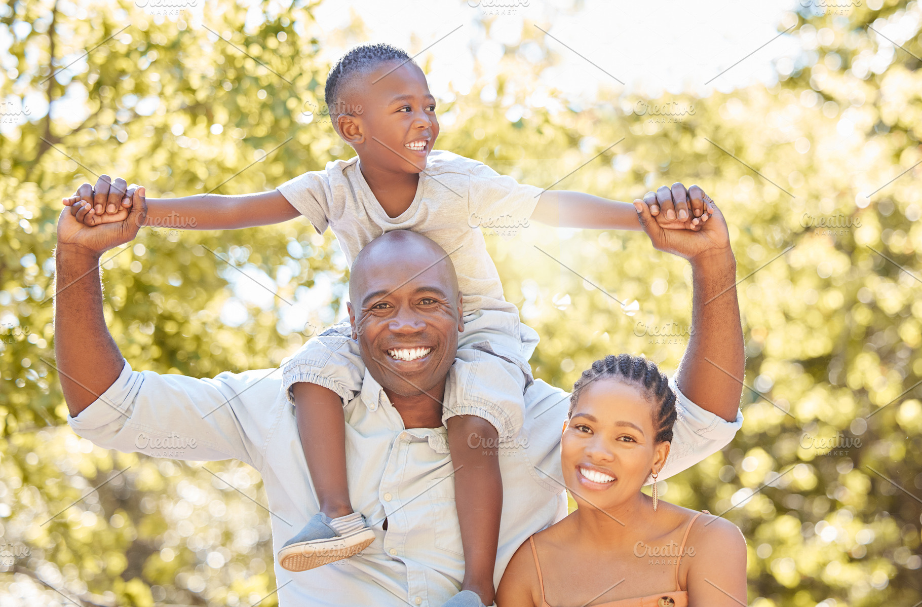 Portrait happy african american family of three spending quality time together in the park during summer. Mother, father and son bonding together outside. A cute boy and his parents smiling outdoors, a Photo by Peopleimages.com
