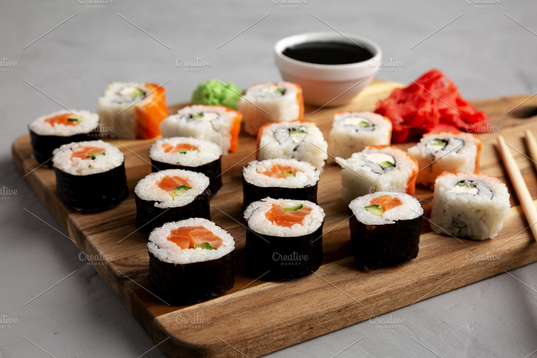 Homemade Sushi Platter with Wasabi and Soy Sauce on a Board, low, a Food & Drink Photo by LiudmylaChuhunova