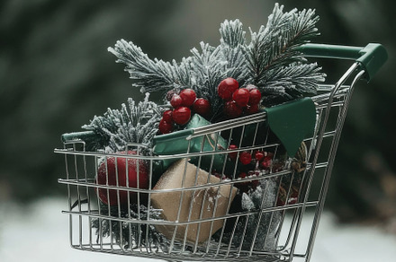 Shopping cart filled with holiday ornaments and pine branches, f, a Photo by Dvoevnore photos