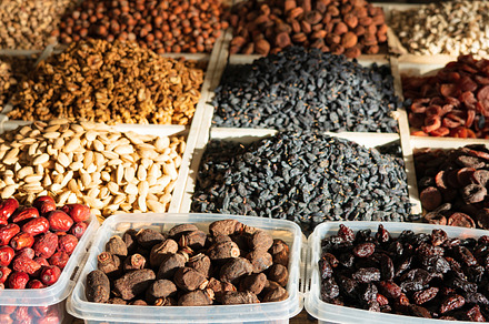 Oriental dried fruits and nuts on the counter of the bazaar., a Food & Drink Photo by Eugene_Photo