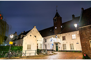 Traditional dutch houses in featuring netherlands, amersfoort, and night, an Architecture Photo by Leonid Andronov